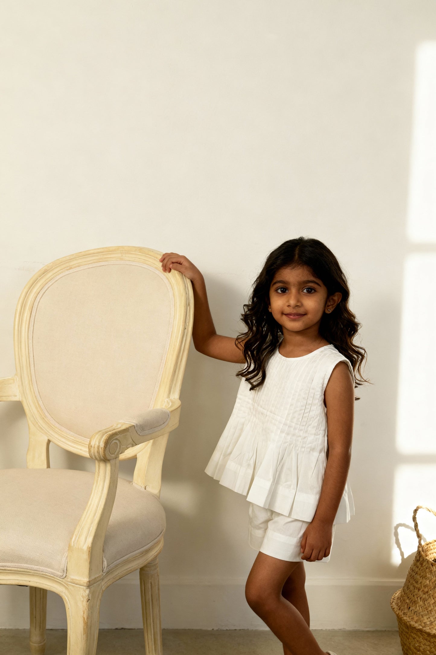 Vienna organic cotton pleated girls blouse styled on child showing fit and drape