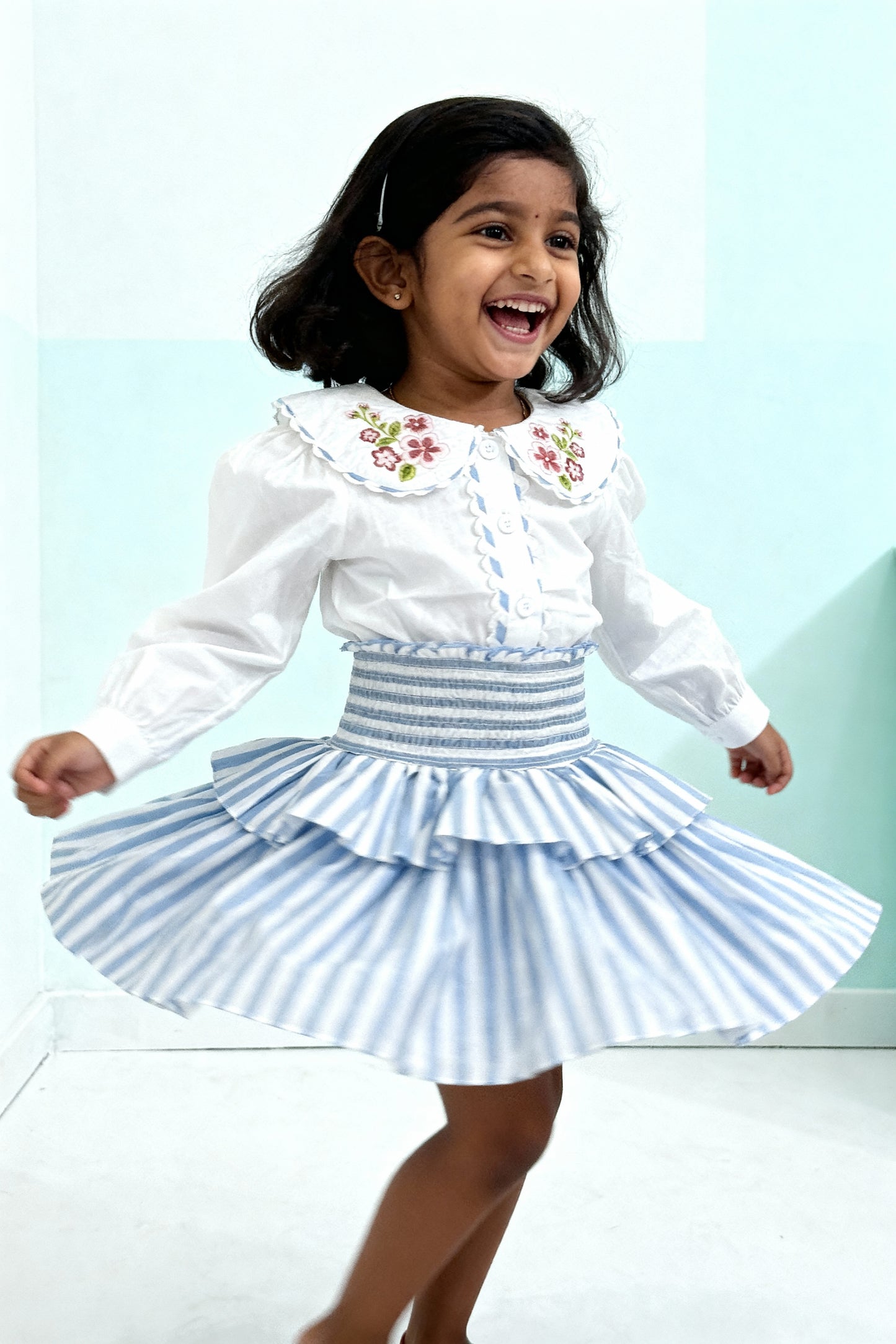 Capri Blouse and Amalfi Skort set styled on child showing coordinated outfit fit