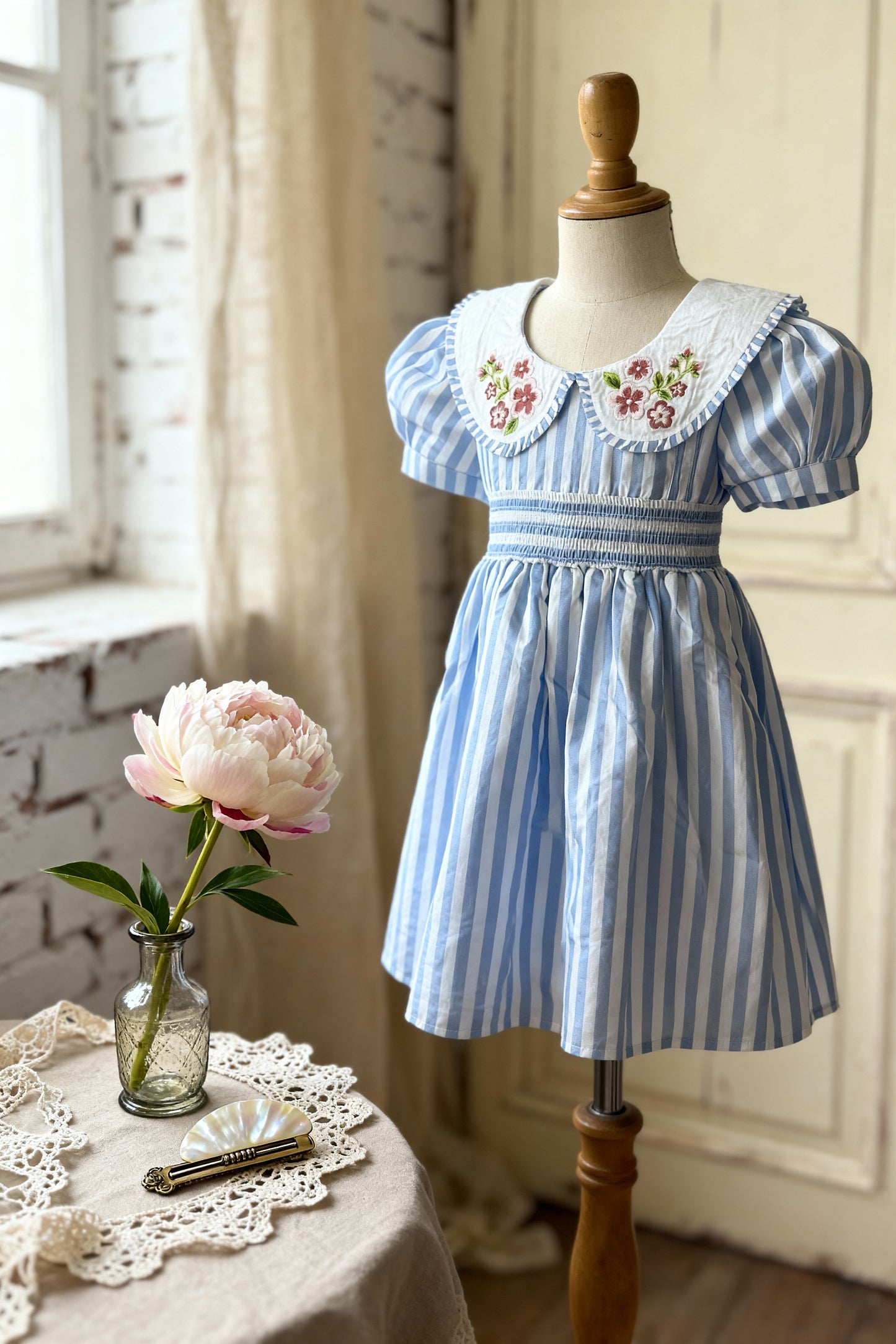 Portofino organic cotton smocked striped girls dress close-up of hand-smocked bodice detailing