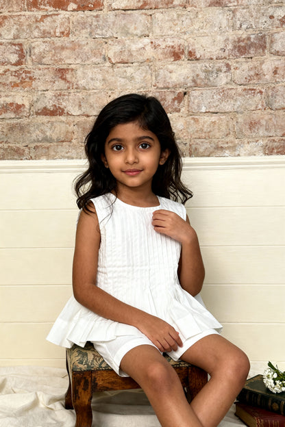 Vienna organic cotton pleated girls blouse back view showing clean relaxed silhouette