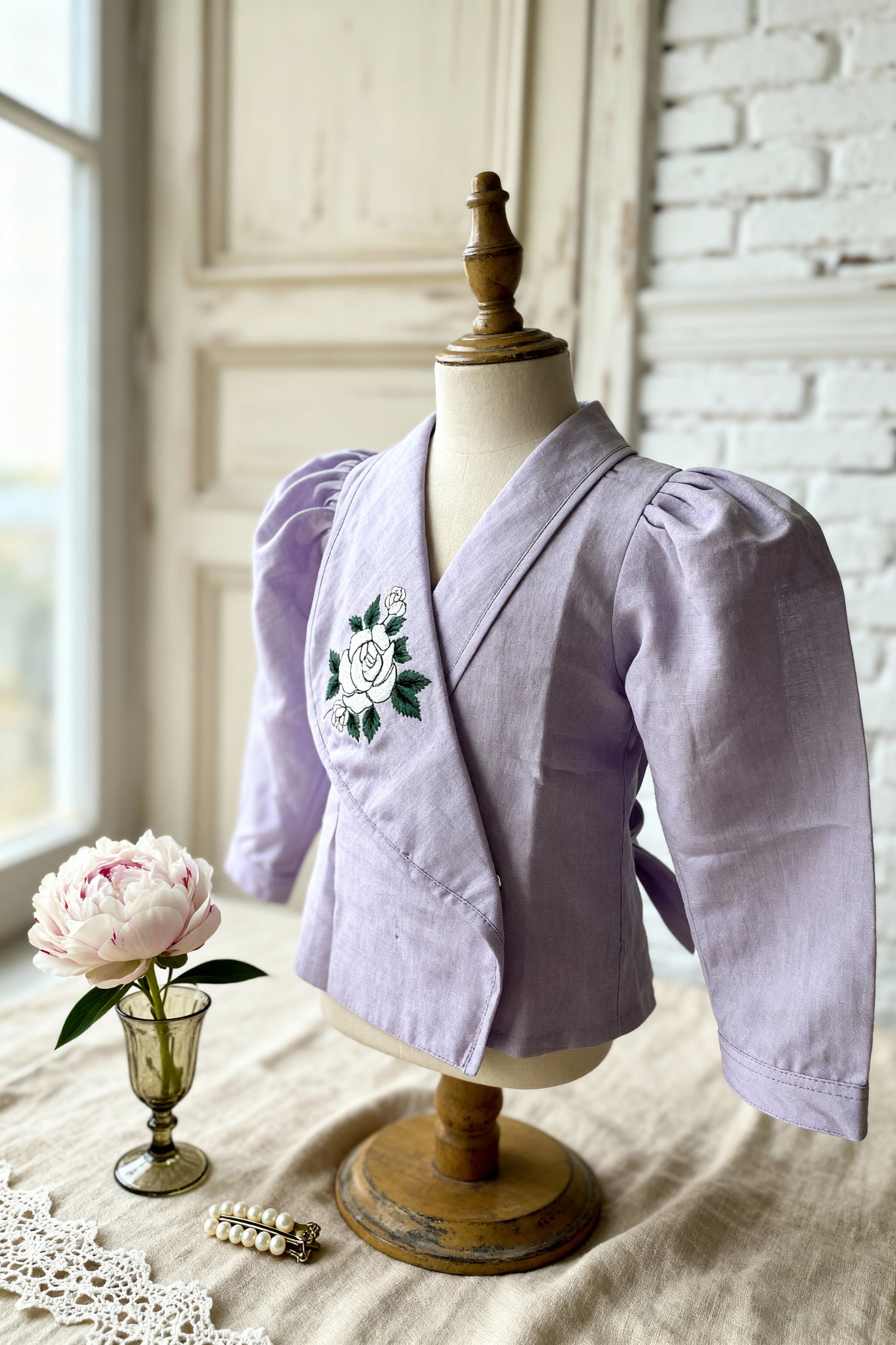 Osaka organic cotton-linen blazer blouse close-up of hand-embroidered rose detail on lapel