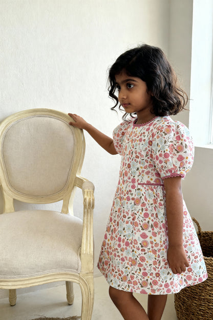 Riviera Rose organic cotton-linen floral puff-sleeve girls dress close-up of floral print and puff sleeve