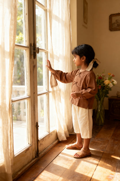 Cairo organic cotton-linen girls blouse flat lay showing button detail and fabric drape