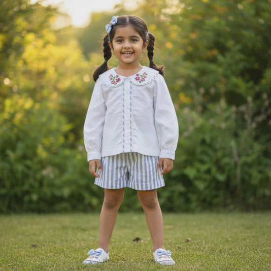 Capri organic cotton girls blouse video showing embroidered Peter Pan collar and puff sleeve details