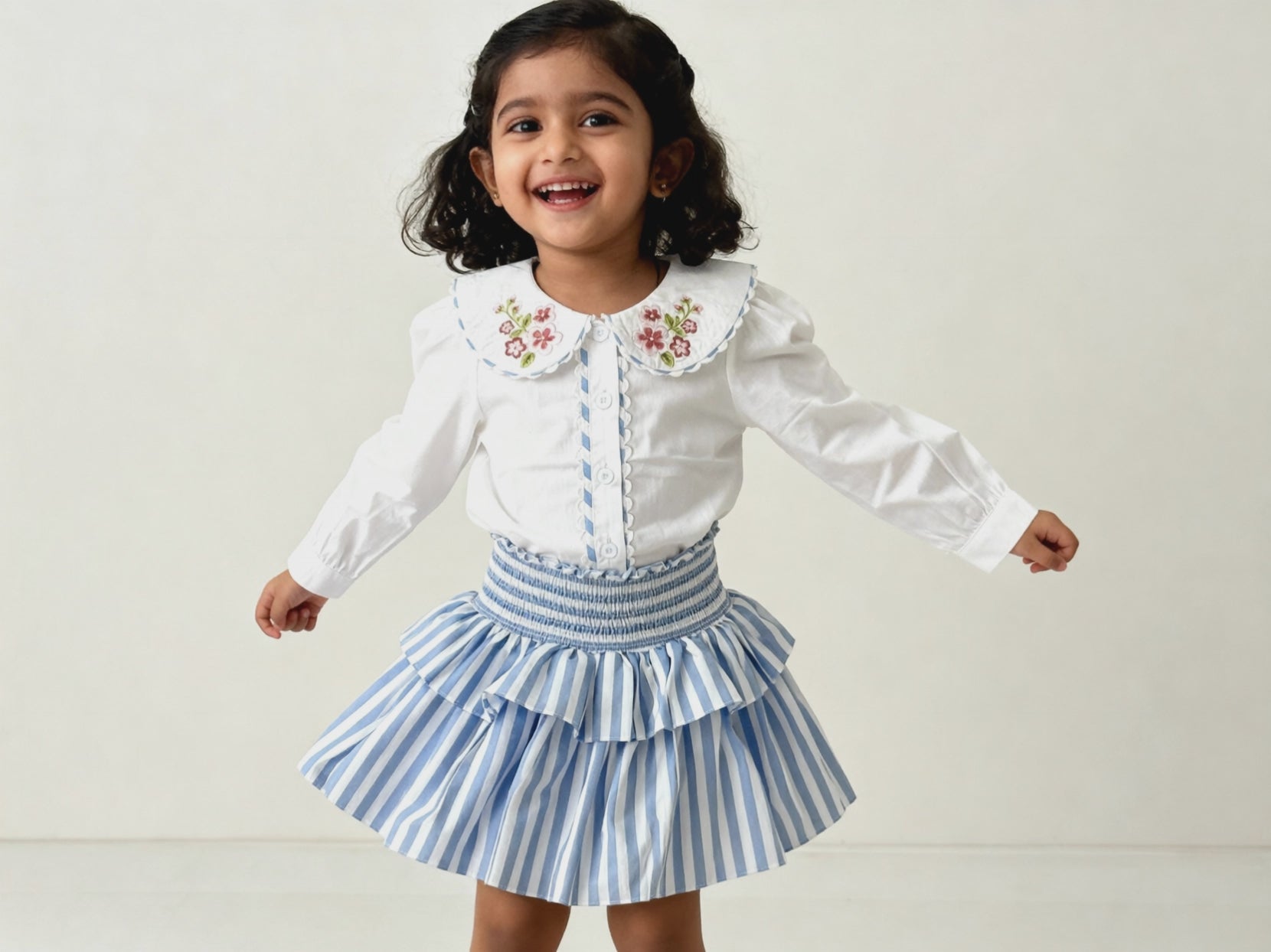 Amalfi organic cotton girls skort video showing flowy double-tier movement and smocked waistband