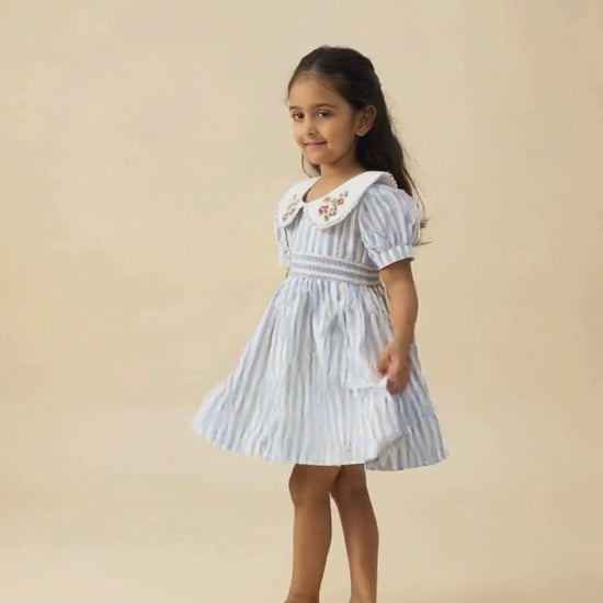 Portofino organic cotton smocked striped girls dress video showing movement and hand-smocked bodice detail