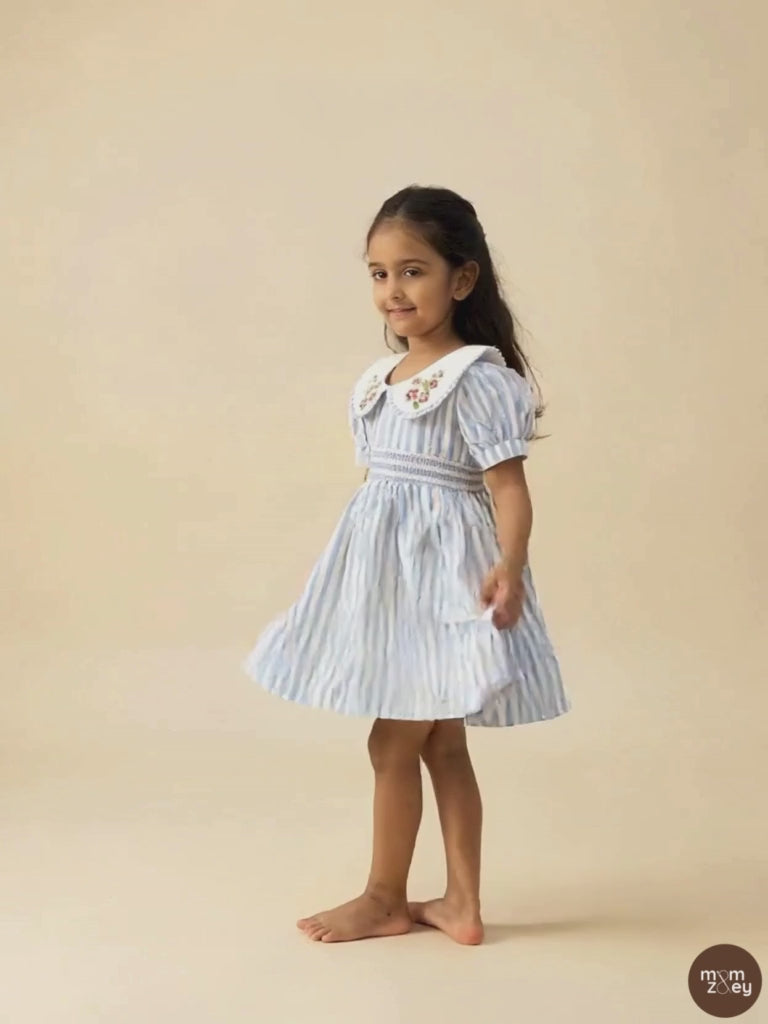 Portofino organic cotton smocked striped girls dress video showing movement and hand-smocked bodice detail