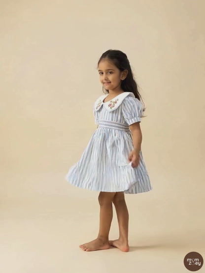 Portofino organic cotton smocked striped girls dress video showing movement and hand-smocked bodice detail