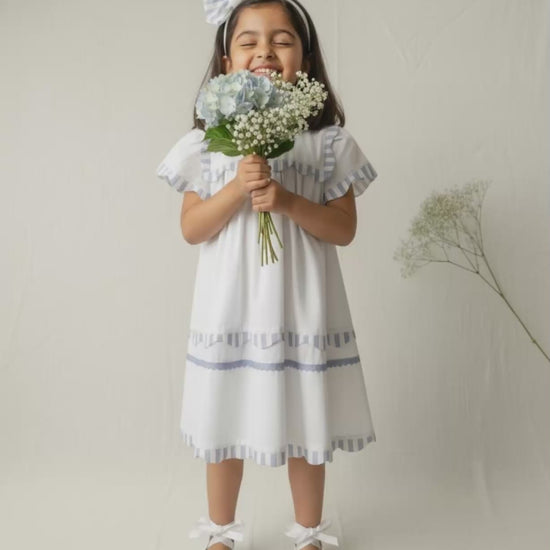 Santorini organic cotton flutter-sleeve girls dress video showing breezy movement and fabric drape