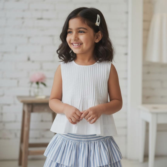Vienna organic cotton pleated girls blouse video showing fabric movement and pleated front detail